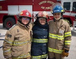 Yoselin Alejandra Orellana Ramos, a Salvadoran Firefighter II, and two Guatemalan female firefighters pose for a photo during CENTAM SMOKE at Soto Cano Air Base, Honduras, April 23, 2024. El Salvador has been participating in CENTAM SMOKE since 2007, but this iteration El Salvador sent a female firefighter increasing female participation in the multinational exercise to 18%.