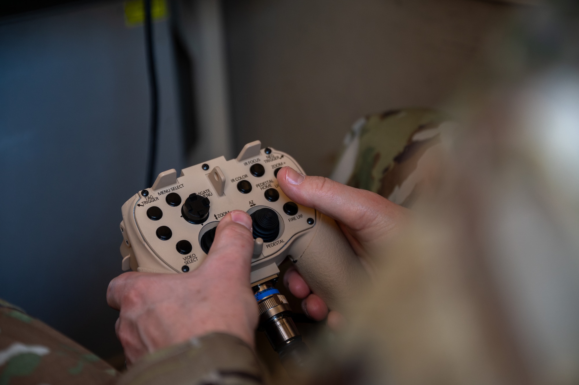 An Airman uses a controller