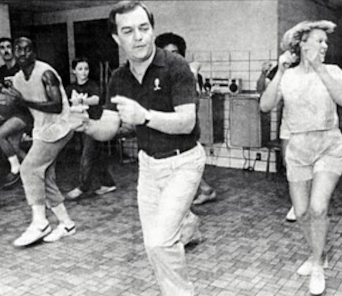 Edwards in center practice a routine with TIB members in the background