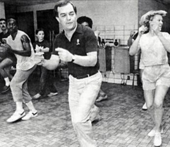 Edwards in center practice a routine with TIB members in the background