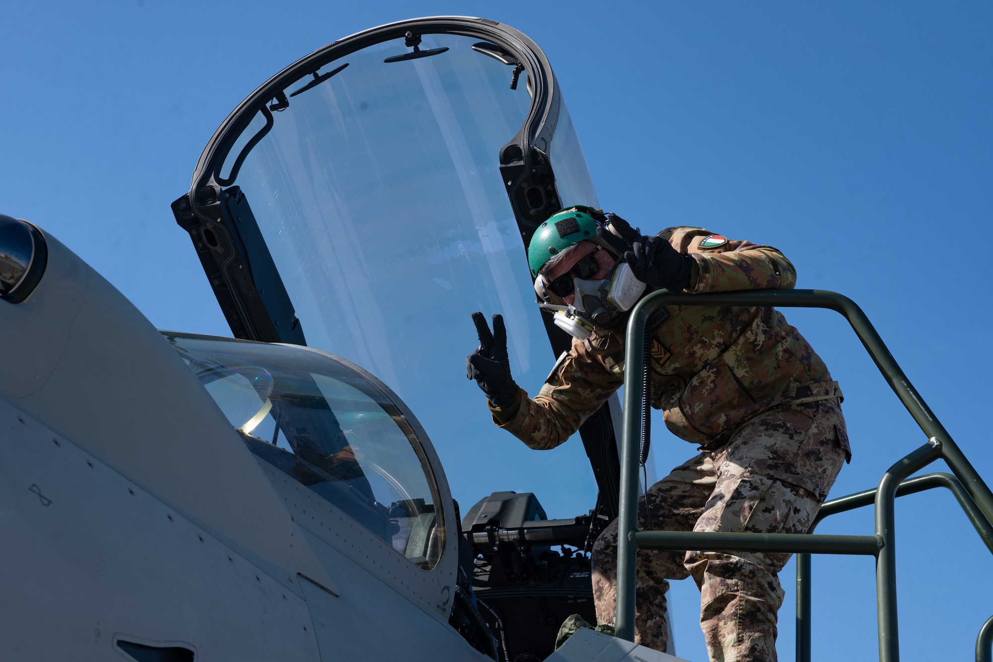 An Italian Air Force crew chief poses for a photo during Red Flag Alaska 24-1.