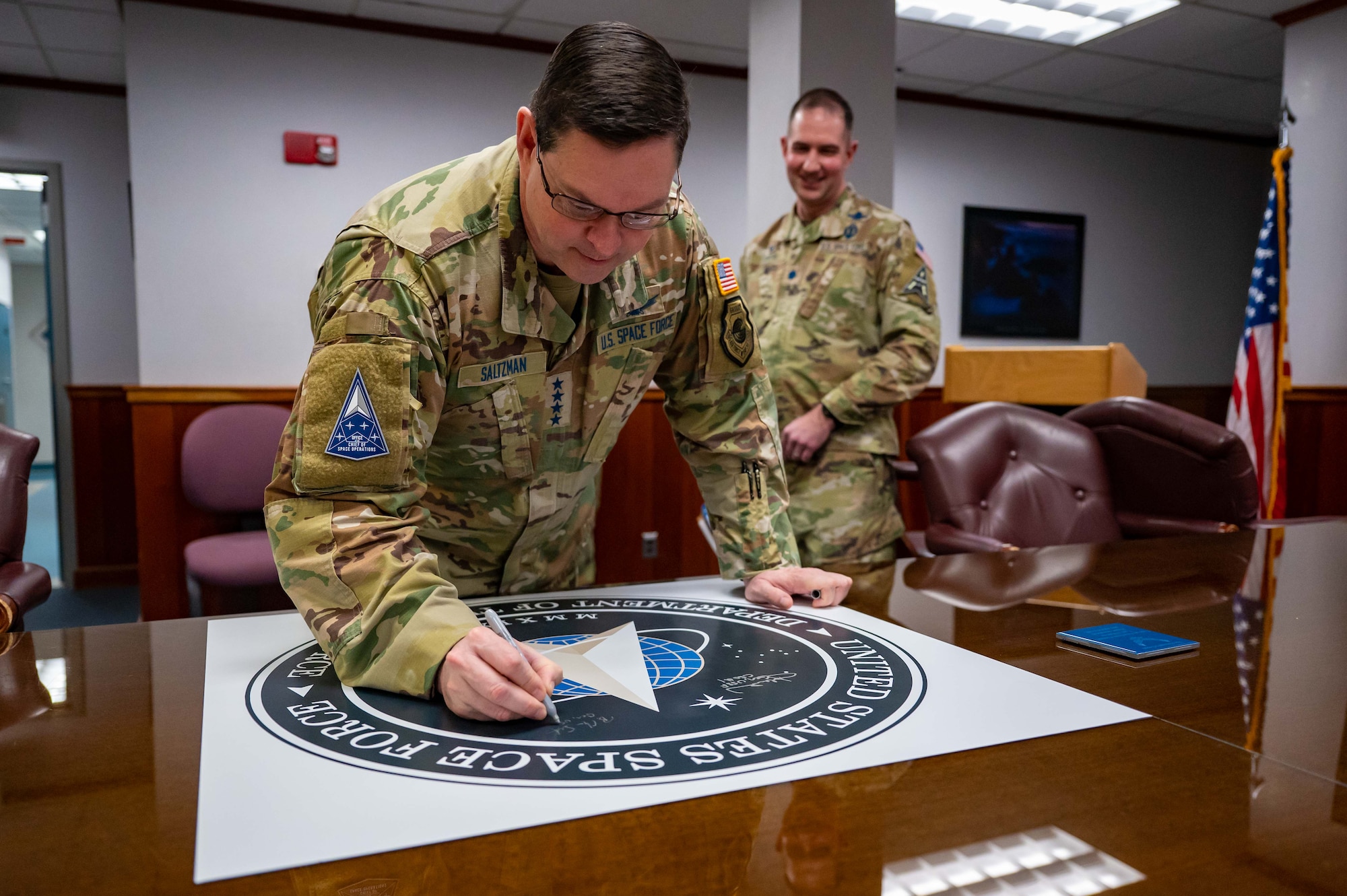 Man signing a picture