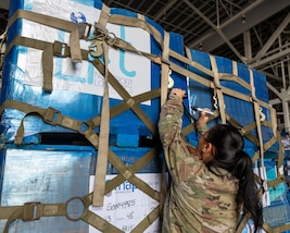Airmen from the 482d Fighter Wing and Special Operations Command South (SOCSOUTH) join forces with the 317th Airlift Wing, who provided their C-130 Hercules, blaze the trail in loading pallets of medical supplies and electrolyte solution at Homestead Air Reserve Base, Fla., on April 26, 2024.