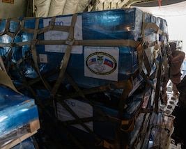 Airmen from the 482d Fighter Wing and Special Operations Command South (SOCSOUTH) join forces with the 317th Airlift Wing, who provided their C-130 Hercules, blaze the trail in loading pallets of medical supplies and electrolyte solution at Homestead Air Reserve Base, Fla., on April 26, 2024.