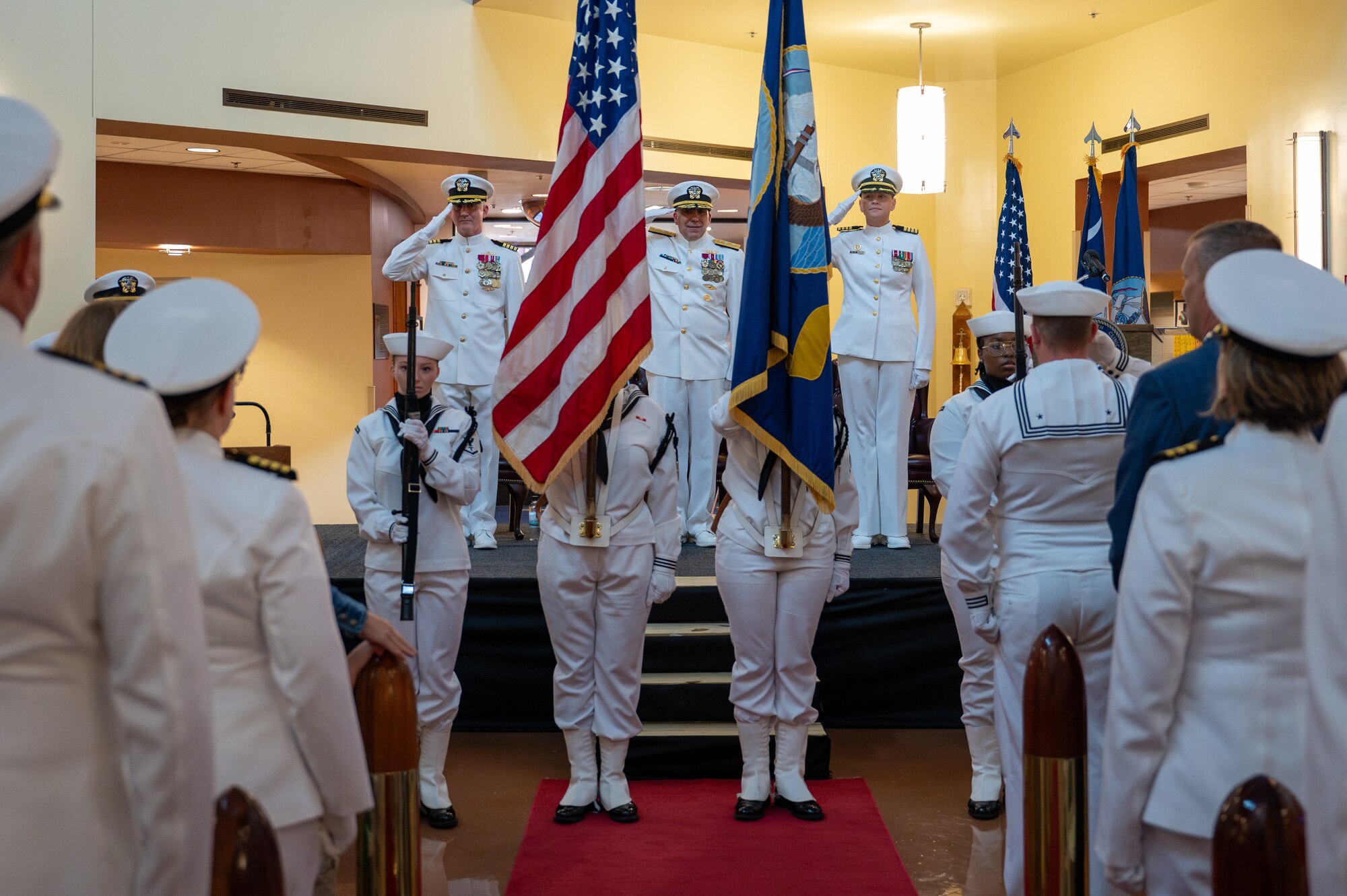 A photo of several people saluting the colors.