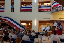A photo of a woman speaking to the crowd.