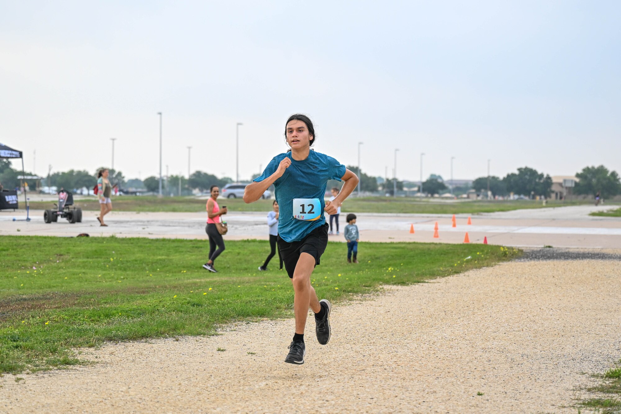 Eduardo Barajas, a 16-year-old top runner, finishes first in the Alcohol Awareness Month 5K at Wilford Hall Ambulatory Surgical Center, Joint Base San Antonio-Lackland, Texas, April 27, 2024. Barajas shared he enjoys cross country and has run in over 10 other 5Ks. (Air Force photo by Senior Airman Melody Bordeaux)