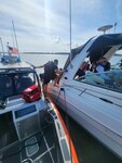 A Coast Guard Station Charleston boat crew and local partner agencies assist eight people after their 34-foot vessel ran aground on the Stono River near James Island, South Carolina, April 27, 2024.