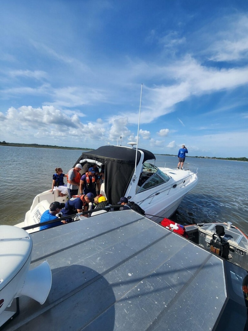 A Coast Guard Station Charleston boat crew and local partner agencies assist eight people after their 34-foot vessel ran aground on the Stono River near James Island, South Carolina, April 27, 2024.