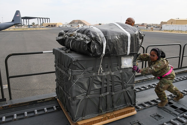 A U.S. Air Force port operations Airman loads pallets of humanitarian aid destined for Gaza aboard a C-130J Super Hercules at an undisclosed location within the U.S. Central Command area of responsibility, April 28, 2024. The U.S. Air Force’s rapid global mobility capability is enabling the expedited movement of critical, life-saving supplies to Gaza. (U.S. Air Force photo)