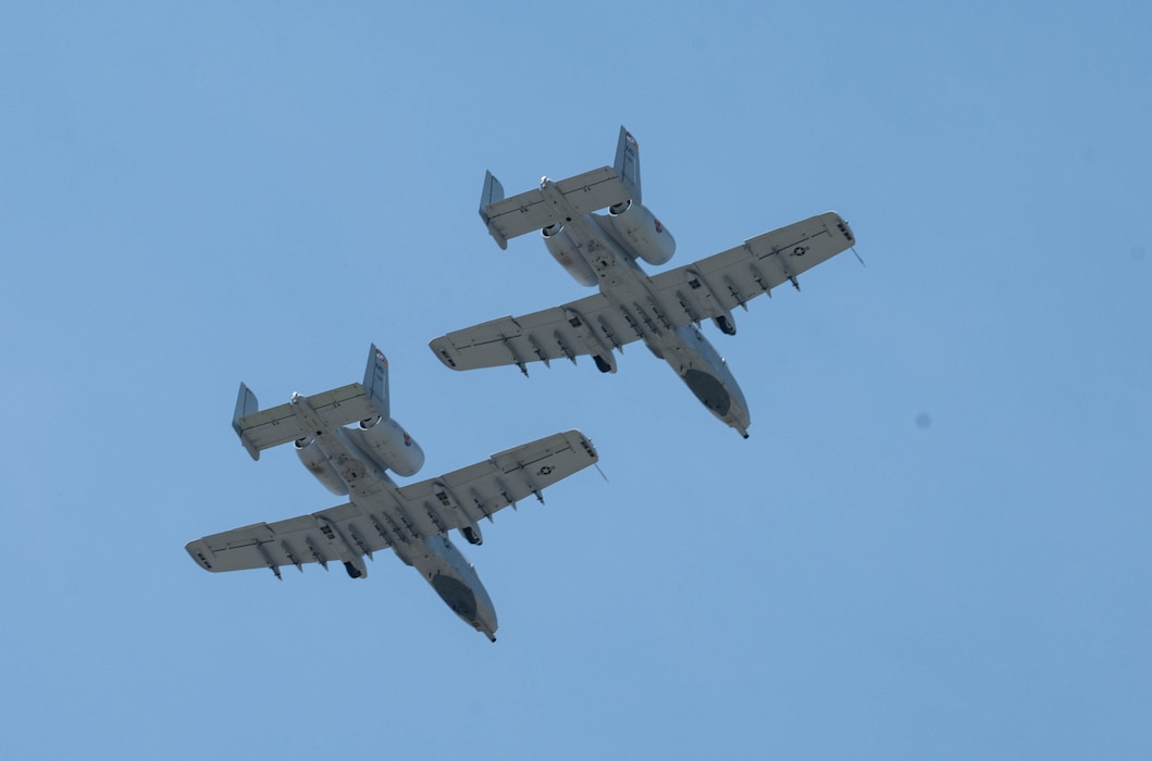Two A-10C Thunderbolt IIs fly over during the Würth 400 NASCAR Cup Series at Dover Motor Speedway in Dover, Delaware, April 28, 2024. Dover Air Force Base’s Eagle Choir, Chaplain and Honor Guard were present as part of the opening ceremonies during race weekend. (U.S. Air Force photo by Airman Liberty Matthews)