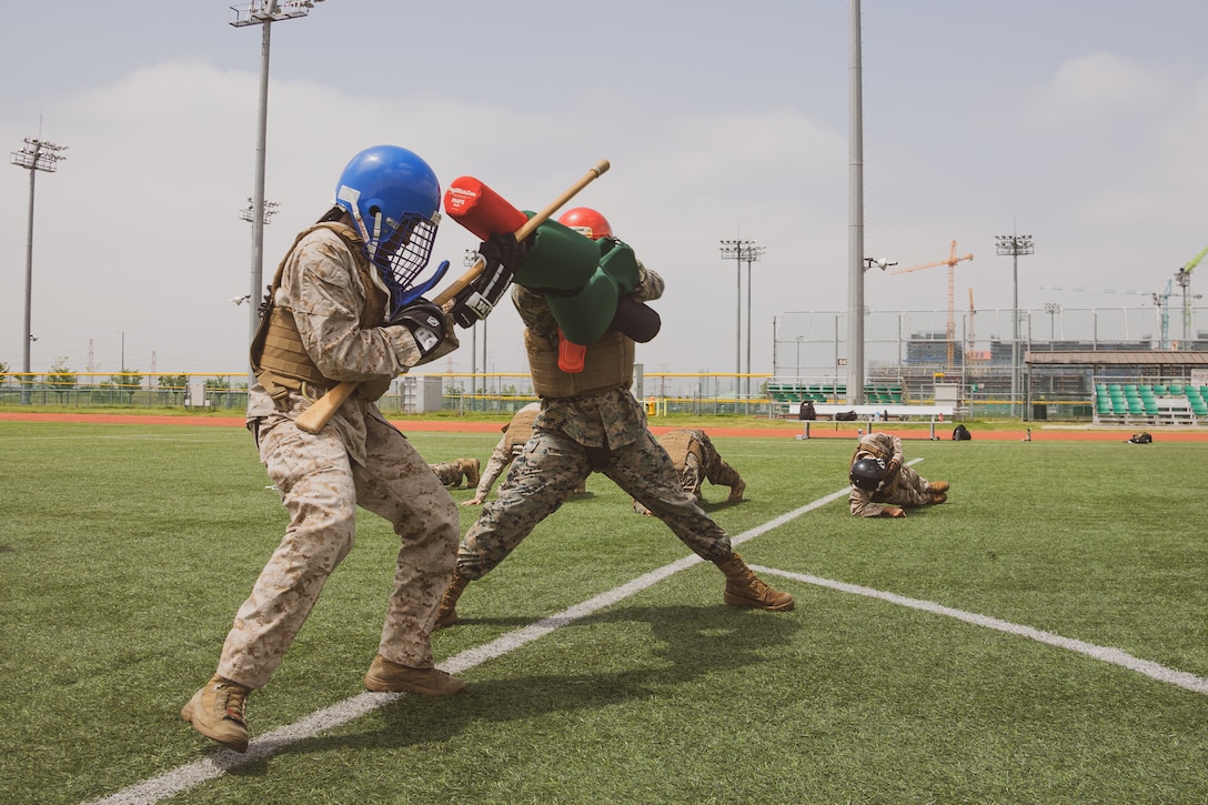 U.S. Marines with U.S. Marine Corps Forces Korea, conduct physical training during a Marine Corps Martial Arts Program training session at U.S. Army Garrison Humphreys, Republic of Korea, April 25th, 2024. MCMAP is an integrated, weapons-based training system that incorporates the full spectrum of the force continuum on the battlefield and contributes to the mental and physical development of Marines. (U.S. Marine Corps photo by Cpl. Dean Gurule)