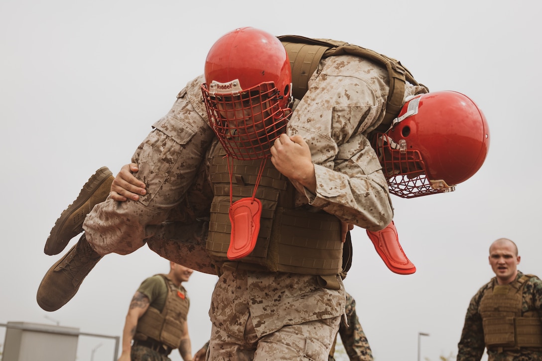 U.S. Marines with U.S. Marine Corps Forces Korea, conduct physical training during a Marine Corps Martial Arts Program training session at U.S. Army Garrison Humphreys, Republic of Korea, April 25th, 2024. MCMAP is an integrated, weapons-based training system that incorporates the full spectrum of the force continuum on the battlefield and contributes to the mental and physical development of Marines. (U.S. Marine Corps photo by Cpl. Dean Gurule)