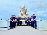 A portion of the crew of the USCGC Frederick Hatch (WPC 1143) stands for a photo on March 14, 2024, in Santa Rita, Guam. In January 2024, the Surface Navy Association National Symposium in Washington, D.C., was marked by the commendation of the USCGC Frederick Hatch (WPC 1143) crew as the recipient of the prestigious 2023 Hopley Yeaton Cutter Excellence Award (Small). This accolade recognizes operational efficiency and pays tribute to the spirit of pioneering leadership and maritime governance that defines the U.S. Coast Guard. (U.S. Coast Guard photo by Chief Warrant Officer Sara Muir)