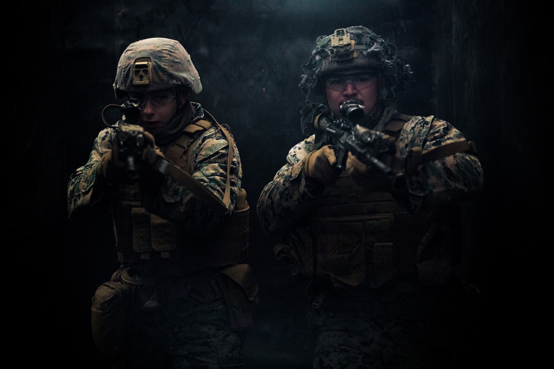 U.S. Marine Corps Lance Cpl. Matthew Pullman, left, and Cpl. Ryan Roberts, right, execute a close-quarters combat drill during Warrior Shield 24 at Rodriguez Live Fire Complex, Pocheon, South Korea, March 6, 2024. Warrior Shield 24 is an annual joint, combined exercise held on the Korean Peninsula that seeks to strengthen the combined defensive capabilities of ROK and U.S. forces. This routine, regularly scheduled, field training exercise provides the ROK and U.S. Marines the opportunity to rehearse combined operations, exchange knowledge, and demonstrate the strength and capabilities of the ROK-U.S. Alliance. Pullman, a native of South Carolina, and Roberts, a native of Pennsylvania, are mortarmen with 2nd Battalion 8th Marine Regiment and is forward deployed in the Indo-Pacific under 4th Marines, 3d Marine Division as part of the Unit Deployment Program. (U.S. Marine Corps photo by Lance Cpl. Matthew Morales)