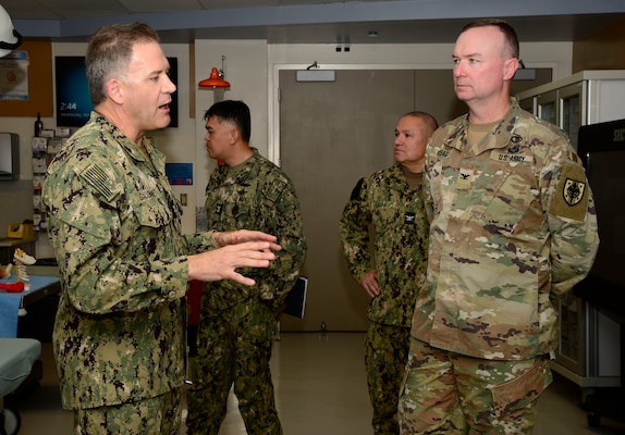 U.S. Navy Capt. Cory Gaconnet, Naval Medical Center San Diego's Bioskills and Simulation Training Center department head, left, speaks to U.S. Army Col. Albert Kinkead, Uniformed Services University of Health Science Brigade Commander, right, and team members during a visit and tour at NMCSD, April 24, 2024. Navy Medicine Readiness and Training Command San Diego’s mission is to prepare service members to deploy in support of operational forces, deliver high quality healthcare services and shape the future of military medicine through education, training and research. NMRTC San Diego employs more than 6,000 active duty military personnel, civilians and contractors in Southern California to provide patients with world-class care anytime, anywhere. (U.S. Navy photo by Mass Communication Specialist 2nd Celia Martin)