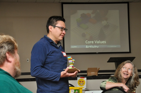 Julio Delgado, Strategic Weapons Facility, Atlantic employee, presents his creation demonstrating the core value “fun” to the class, during the DoD FIRST Lego course at Naval Submarine Base Kings Bay, Ga., April 23-24. The program provides elementary, middle and high school teachers with kits and skills to assist with teaching children ages 4 to 18 about science, technology, engineering, and math (STEM) through engaging, hands-on learning.