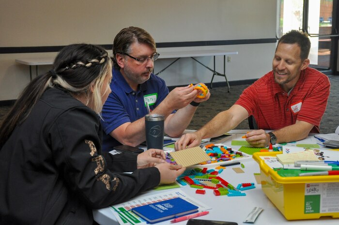 Jamie Anderson, Peter Dorando and Jeffrey Brewer, Strategic Weapons Facility, Atlantic employees, make a creation during the DoD FIRST Lego course at Naval Submarine Base Kings Bay, Ga., April 23-24. The program provides elementary, middle and high school teachers with kits and skills to assist with teaching children ages 4 to 18 about science, technology, engineering, and math (STEM) through engaging, hands-on learning.