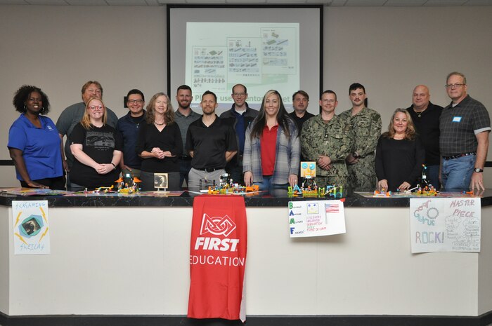 Strategic Weapons Facility, Atlantic personnel and two Saint Marys Middle School teachers pose for a group photo during the DoD FIRST Lego course at Naval Submarine Base Kings Bay, Ga., April 23-24. The program provides elementary, middle and high school teachers with kits and skills to assist with teaching children ages 4 to 18 about science, technology, engineering, and math (STEM) through engaging, hands-on learning.