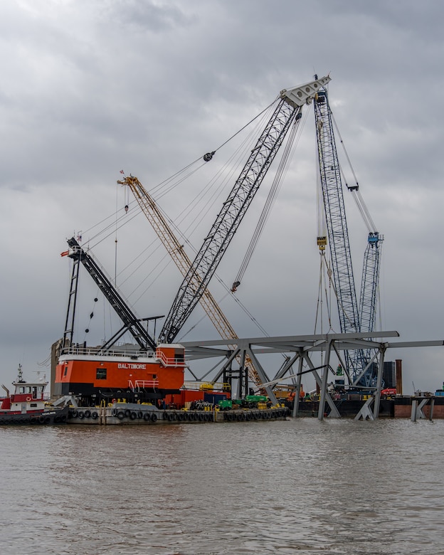 A large number of floating cranes can be seen at the site of the Francis Scott Key Bridge collapse.