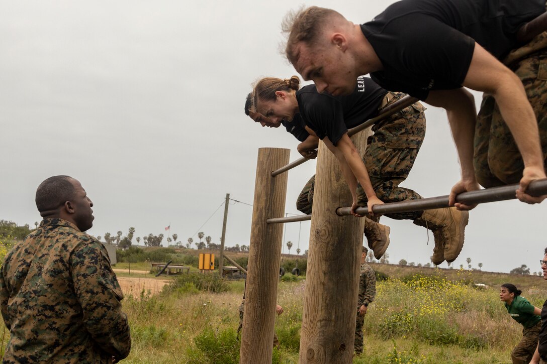 U.S. Marine Corps candidates with 12th Marine Corps District complete an obstacle course during a Mini-Officer Candidates School event at Marine Corps Base Camp Pendleton in Oceanside, Calif., April 20. Mini OCS gives candidates and applicants an idea of what to expect at Marine Corps Officer Candidates School. (U.S. Marine Corps photo by Sgt. Jesula Jeanlouis)