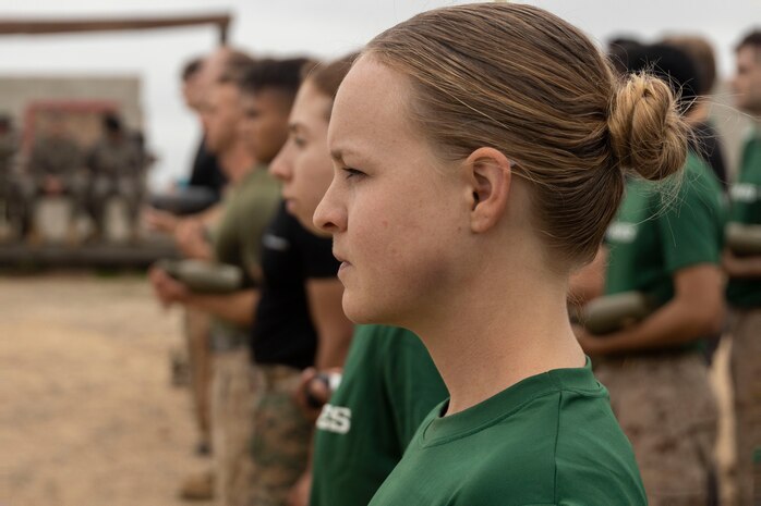 U.S. Marine Corps candidates with 12th Marine Corps District stand in formation during a Mini-Officer Candidates School event at Marine Corps Base Camp Pendleton in Oceanside, Calif., April 20. Mini OCS gives candidates and applicants an idea of what to expect at Marine Corps Officer Candidates School. (U.S. Marine Corps photo by Sgt. Jesula Jeanlouis)