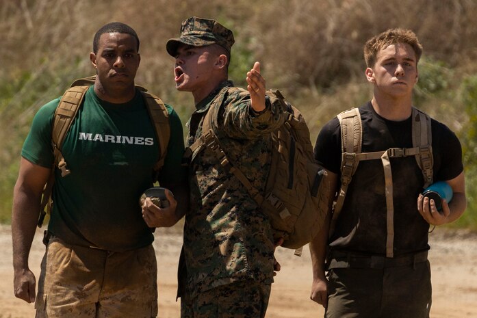 U.S. Marine Corps Staff Sgt. Andre L. Velez, a sergeant instructor with Officer Candidates School, gives a candidate encouragement during a Mini-Officer Candidates School event at Marine Corps Base Camp Pendleton in Oceanside, Calif., April 20. Mini OCS gives candidates and applicants an idea of what to expect at Marine Corps Officer Candidates School. (U.S. Marine Corps photo by Sgt. Jesula Jeanlouis)