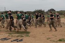 U.S. Marine Corps candidates with 12th Marine Corps District run during a Mini-Officer Candidates School event at Marine Corps Base Camp Pendleton in Oceanside, Calif., April 20. Mini OCS gives candidates and applicants an idea of what to expect at Marine Corps Officer Candidates School. (U.S. Marine Corps photo by Sgt. Jesula Jeanlouis)