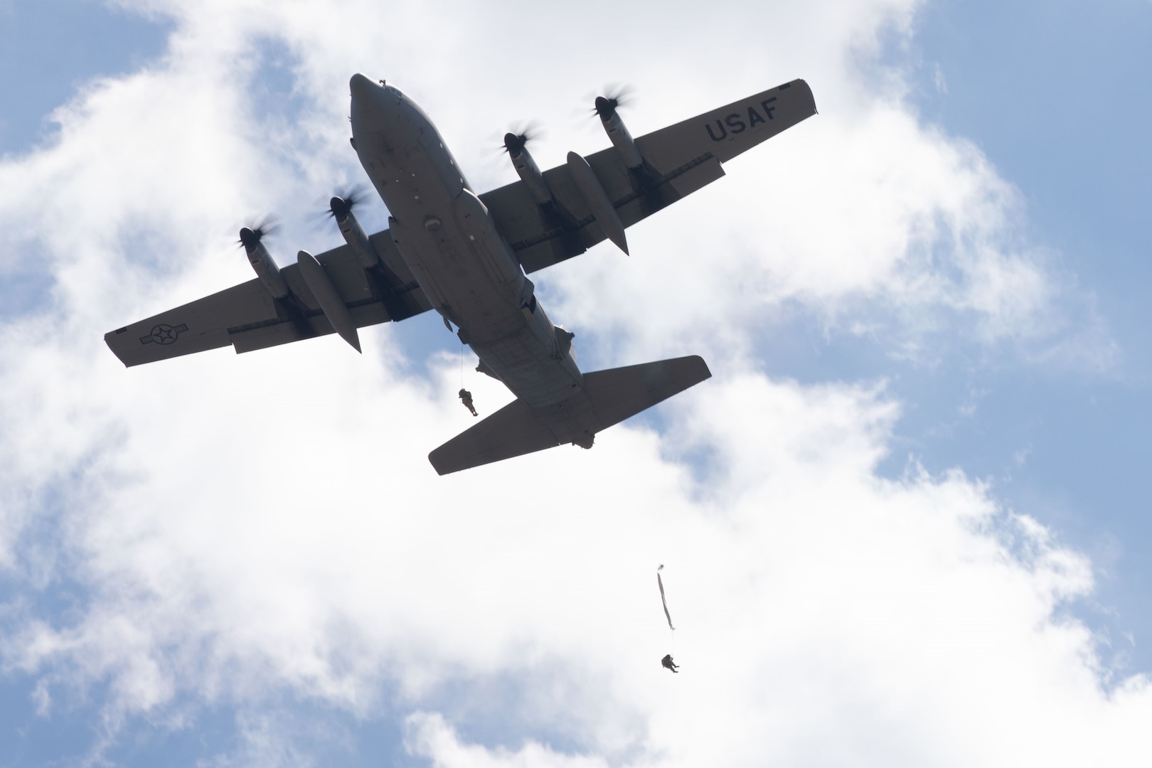 A U.S. Army Soldier conducts a static line airborne jump out of a C-130 Hercules cargo plane during the Joint Parachute Operational Mishap Preventative Orientation Course Enhanced (POMPOC-E) April 25, 2024, at the Plantation Airpark, Sylvania, Georgia.