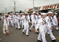 SAN ANTONIO - (April 26, 2024) – More than 100 Sailors within Joint Base San Antonio (JBSA) took part in the Battle of Flowers Parade held during Fiesta San Antonio. The Battle of Flowers Parade is the oldest event and largest parade of Fiesta San Antonio attracting crowds of more than 350,000. Leading the Sailors in the parade was Rear Adm. Walter Brafford, commander, Naval Medical Forces Support Command (NMFSC). Other commands participating included but not limited to Naval Medical Research Unit (NAMRU) San Antonio, Navy Talent Acquisition Group (NTAG) San Antonio, Navy Medicine Training Support Center (NMTSC), and Navy Wounded Warrior (NWW) Program, Navy Reserve Center (NRC) San Antonio, and USS San Antonio (LPD 17). Joint Base San Antonio is proud to be part of the diverse and vibrant community of San Antonio also known as Military City USA. (U.S. Navy Photo by Burrell Parmer, Naval Medical Research Unit San Antonio Public Affairs/Released)