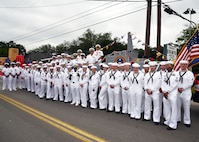 SAN ANTONIO - (April 26, 2024) – More than 100 Sailors within Joint Base San Antonio (JBSA) took part in the Battle of Flowers Parade held during Fiesta San Antonio. The Battle of Flowers Parade is the oldest event and largest parade of Fiesta San Antonio attracting crowds of more than 350,000. Leading the Sailors in the parade was Rear Adm. Walter Brafford, commander, Naval Medical Forces Support Command (NMFSC). Other commands participating included but not limited to Naval Medical Research Unit (NAMRU) San Antonio, Navy Talent Acquisition Group (NTAG) San Antonio, Navy Medicine Training Support Center (NMTSC), and Navy Wounded Warrior (NWW) Program, Navy Reserve Center (NRC) San Antonio, and USS San Antonio (LPD 17). Joint Base San Antonio is proud to be part of the diverse and vibrant community of San Antonio also known as Military City USA. (U.S. Navy Photo by Burrell Parmer, Naval Medical Research Unit San Antonio Public Affairs/Released)