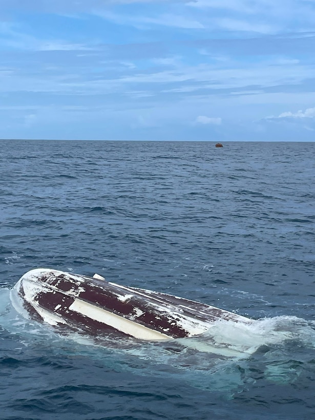 A Coast Guad Station San Juan 33-Special Purpose Craft boat crew rescued three fishermen from the hull of the 22-foot recreational vessel Elaine, April 27, 2024, after a large wave caused the vessel to capsize, approximately two nautical miles north of Dorado, Puerto Rico.  All three boaters were wearing their lifejackets and there were not injuries or medical emergencies.  (U.S. Coast Guard photo)