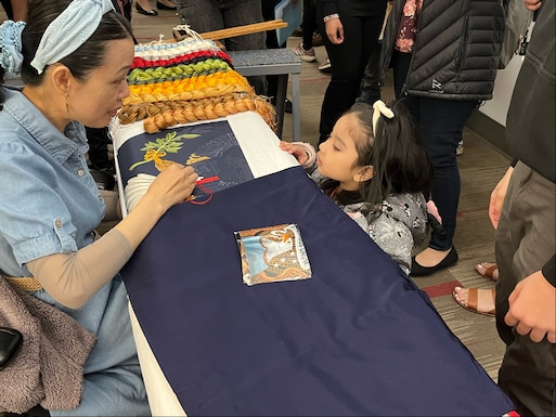 Defense Logistics Agency Troop Support gave children an up-close look at flag making during Take Our Daughters and Sons to Work Day on April 25