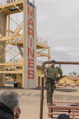 U.S. Marine Corps Sgt. Anthony Ruiz, a helicopter rope suspension technique master with Support Battalion, Recruit Training Regiment, gives a rappel tower demonstration to educators from Recruiting Stations Chicago, Kansas City and Saint Louis as part of the 2024 Educator’s Workshop at MCRD San Diego, California, April 25, 2024. Participants of the workshop visit MCRD San Diego to observe recruit training and gain a better understanding about the transformation from recruits to United States Marines. Educators also received classes and briefs on the benefits that are provided to service members serving in the United States armed forces. (U.S. Marine Corps photo by Lance Cpl. Alexandra M. Earl)