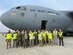 Chief of Staff of the Air Force Strategic Studies Group, Air Mobility Command A4T, Tesseract, Bunker Supply, Boeing and Heavy Airlift Wing personnel pose with the K-Wedge prototype post-test in front of a C-17 Globemaster III at Papa Air Base, Hungary, Jan. 29,2024. The K-Wedge is an installable C-17 loading aid and low-cost solution that eliminates preventable damage during cargo loading operations. (U.S. Air Force photo by 1st Lt. In Bok Lee)
