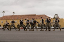 U.S. Marines with Marine Band San Diego play music during a motivational run at Marine Corps Recruit Depot San Diego, California, April 25, 2024. The motivational run is the final training event new Marines complete before graduating which consists of a three-mile run throughout the Depot. (U.S. Marine Corps photo by Lance Cpl. Alexandra M. Earl)