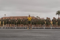U.S. Marine Corps Staff Sgt. Brenda Delosreyes, a senior drill instructor with Golf Company, 2nd Recruit Training Battalion, stands in formation with her platoon after completing the motivational run at Marine Corps Recruit Depot San Diego, California, April 25, 2024. The motivational run is the final training event new Marines complete before graduating which consists of a three-mile run throughout the Depot. (U.S. Marine Corps photo by Lance Cpl. Alexandra M. Earl)