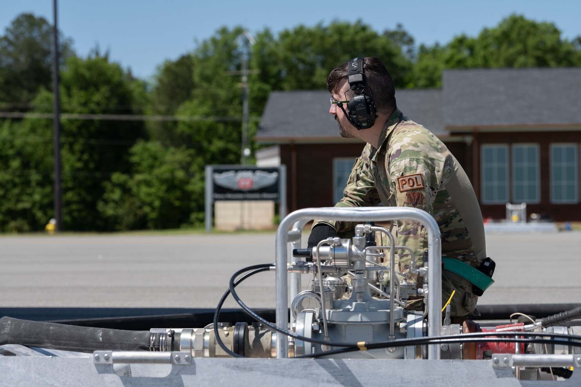 A person crouched down next to a VIPER Kit.