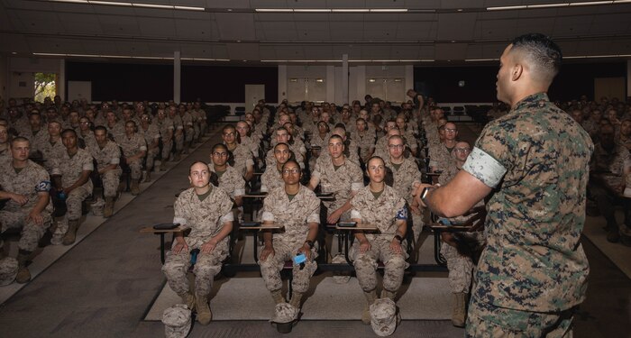 U.S. Marine Corps Sgt. Fernando Zeballos, a drill instructor with Lima Company, 3rd Recruit Training Battalion, gives instructions to recruits during exam one at Marine Corps Recruit Depot San Diego, California, April 24, 2024. The recruits learned how to apply aid to a variety of injuries and how to assemble and disassemble their rifles. Recruits have several opportunities to practice before exam one and the practical application test. (U.S. Marine Corps photo by Lance Cpl. Janell B. Alvarez)