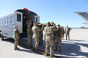 Members of the 445th Aeromedical Staging Squadron unload a manikin from an Ambus during launch and recovery training exercise with 445th Aeromedical Evacuation Squadron Airmen at Wright-Patterson Air Force Base, Ohio, April 6, 2024.