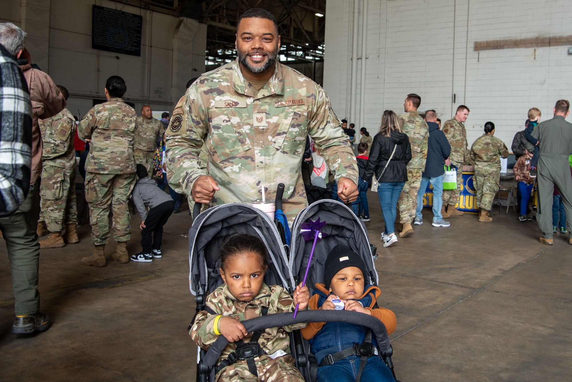 U.S. Air Force Tech. Sgt. Mario Sales, 421st Combat Training Squadron, academics noncommissioned officer in charge, participates in the Bring Your Child to Work Day festivities at Joint Base McGuire-Dix-Lakehurst, N.J., April 25, 2024. The event highlights the JB MDL mission to children during the Month of the Military Child. (U.S. Air Force photo by Jewaun Victor)
