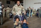 U.S. Air Force Tech. Sgt. Mario Sales, 421st Combat Training Squadron, academics noncommissioned officer in charge, participates in the Bring Your Child to Work Day festivities at Joint Base McGuire-Dix-Lakehurst, N.J., April 25, 2024. The event highlights the JB MDL mission to children during the Month of the Military Child. (U.S. Air Force photo by Jewaun Victor)