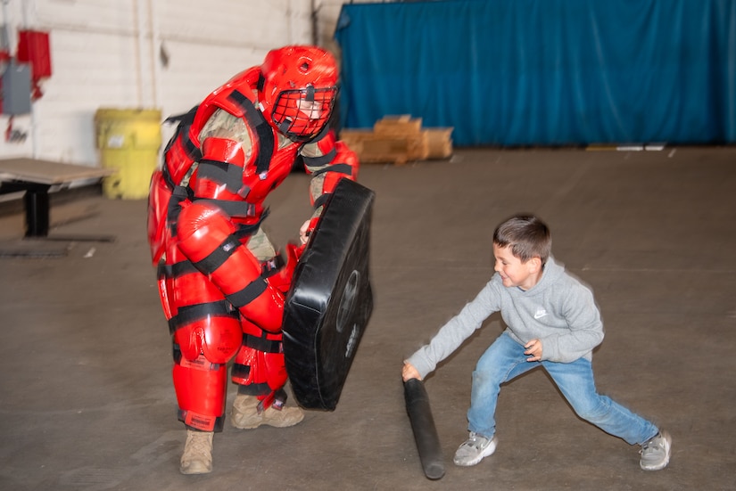 A military youth learns combatives during the Bring Your Child to Work Day at Joint Base McGuire-Dix-Lakehurst, N.J., April 25, 2024. The event highlights the JB MDL mission to children during the Month of the Military Child. (U.S. Air Force photo by Jewaun Victor)