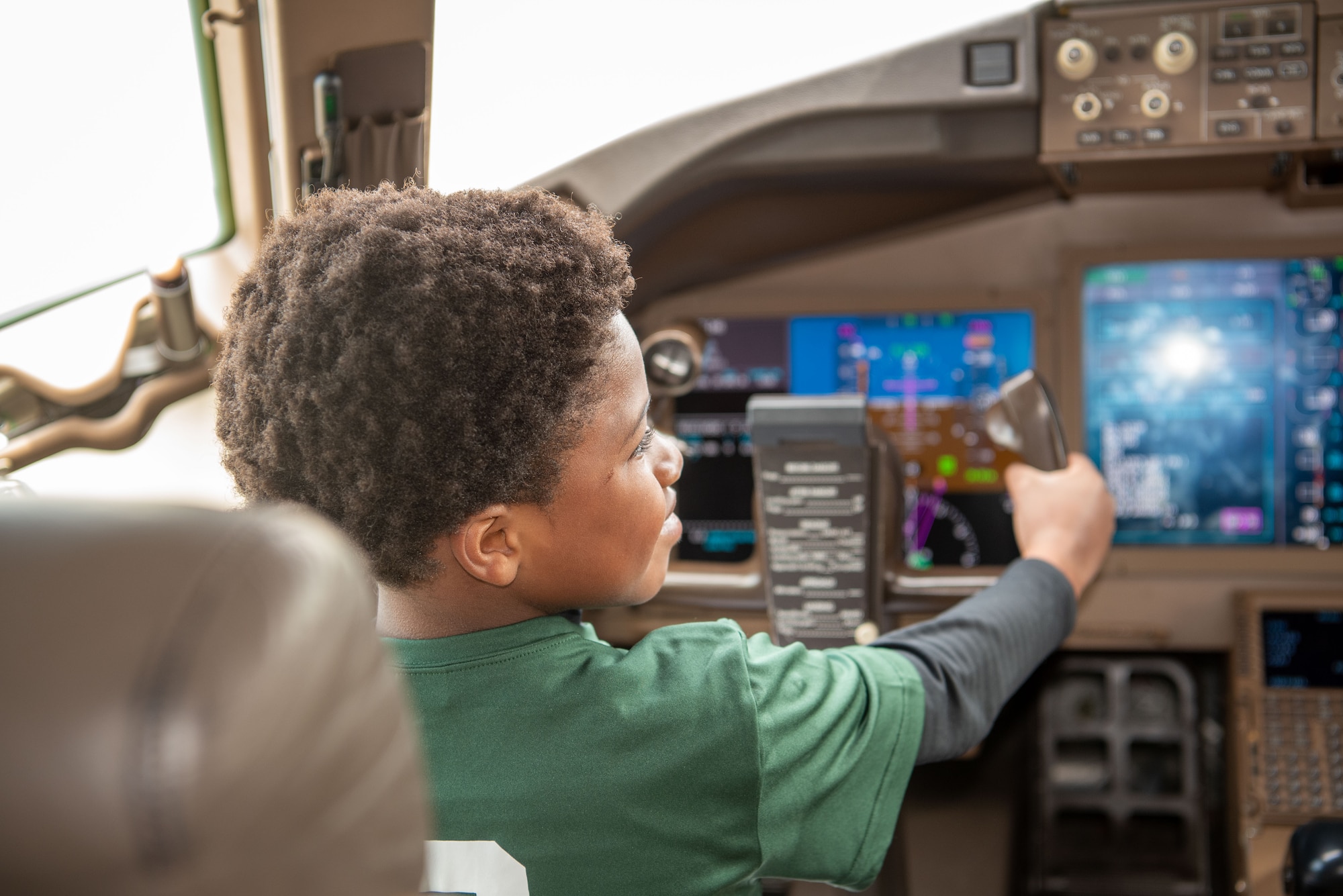 A military youth tours the cockpit of a KC-46A Pegasus Tanker during Bring Your Child to Work Day at Joint Base McGuire-Dix-Lakehurst, N.J., April 25, 2024. The event highlights the JB MDL mission to children during the Month of the Military Child. (U.S. Air Force photo by Jewaun Victor)