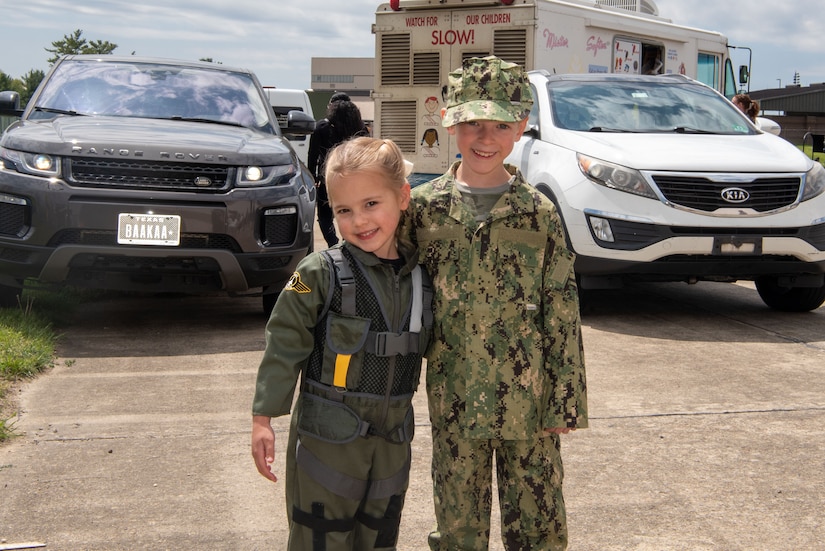 Two children don military uniforms during Bring Your Child to Work Day at Joint Base McGuire-Dix-Lakehurst, N.J., April 25, 2024. The event highlights the JB MDL mission to children during the Month of the Military Child. (U.S. Air Force photo by Jewaun Victor)