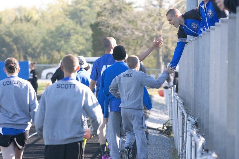 Bluegrass ChalleNGe Academy students cheer on their fellow cadets prior to a track meet Thursday, April 25.