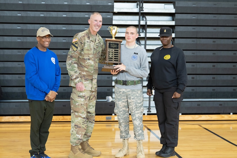 Brig. Gen. Brian Wertzler, Kentucky's assistant adjutant general, presents Bluegrass ChalleNGe Academy with the first-place overall award along with Ret. Col. Dee Briscoe, BCA director and Command Sgt. Maj. Jamemecka Sanders, BCA commandant, at an awards ceremony Friday, April 26.