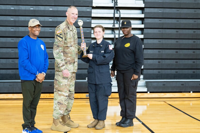 Brig. Gen. Brian Wertzler, Kentucky's assistant adjutant general, presents Battle Creek Youth ChalleNGe Academy with the second place overall award along with Ret. Col. Dee Briscoe, BCA director and Command Sgt. Maj. Jamemecka Sanders, BCA commandant, at an awards ceremony Friday, April 26.