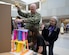 Vice Chairman of the Joint Chiefs of Staff U.S. Navy Admiral Christopher Grady, and his wife, Christine, measure the height of a 'Tallest Paper Tower Challenge' during a visit to Hanscom Middle School at Hanscom Air Force Base, Mass., April 23. The visit underscores the Department of Defense's commitment to strengthening educational initiatives that support military children and local communities. (U.S. Air Force photo by Jerry Saslav)