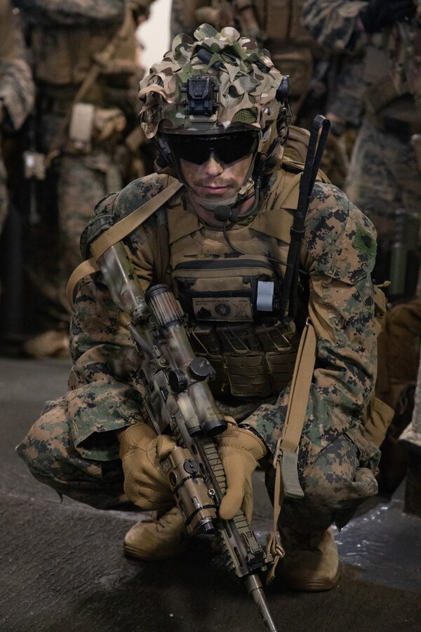 U.S. Marine Corps Sgt. Christopher Wasilewski with Battalion Landing Team 1/8, 24th Marine Expeditionary Unit (MEU), waits on the flight deck ramp aboard the USS Wasp (LHD 1) before conducting a simulated Tactical Recovery of Aircraft and Personnel mission during Composite Training Unit Exercise (COMPTUEX) in the Atlantic Ocean, April 24, 2024. The 24th MEU and Wasp (WSP) Amphibious Ready Group (ARG) are conducting COMPTUEX, their final at-sea, certification exercise under the evaluation of Carrier Strike Group 4 and Expeditionary Operations Training Group. Throughout COMPTUEX, the WSP ARG-24th MEU is evaluated across a spectrum of scenarios that determine their readiness to deploy. (U.S. Marine Corps photo by Cpl. Aydan Millette)